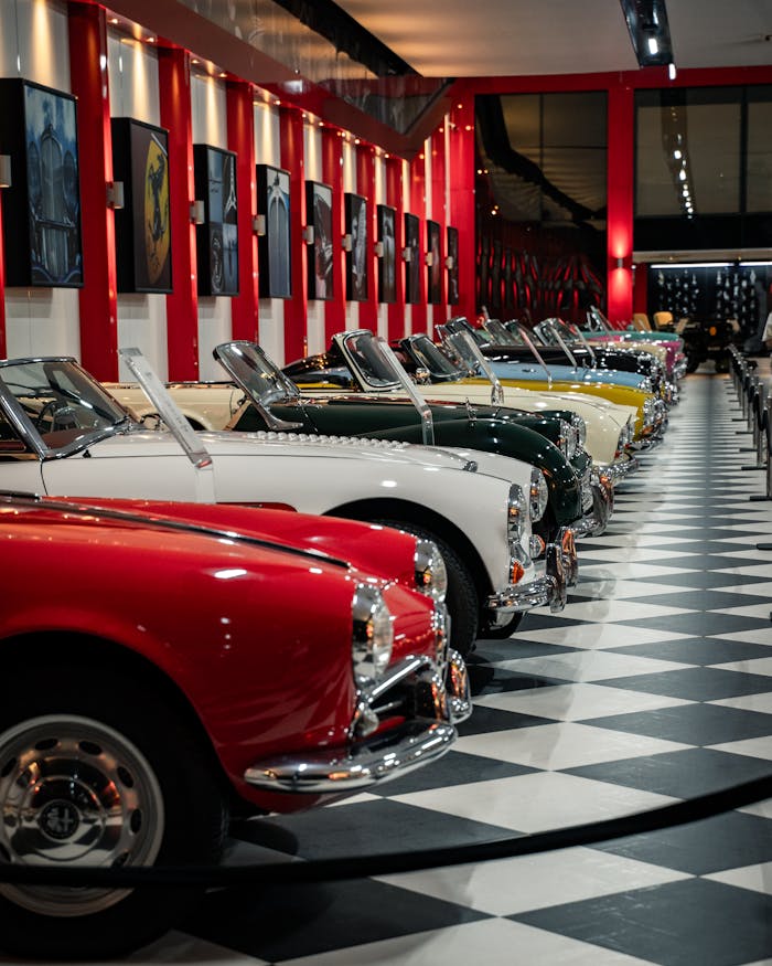 Row of vintage convertible cars on display in an İzmir museum showcasing classic automobile elegance.